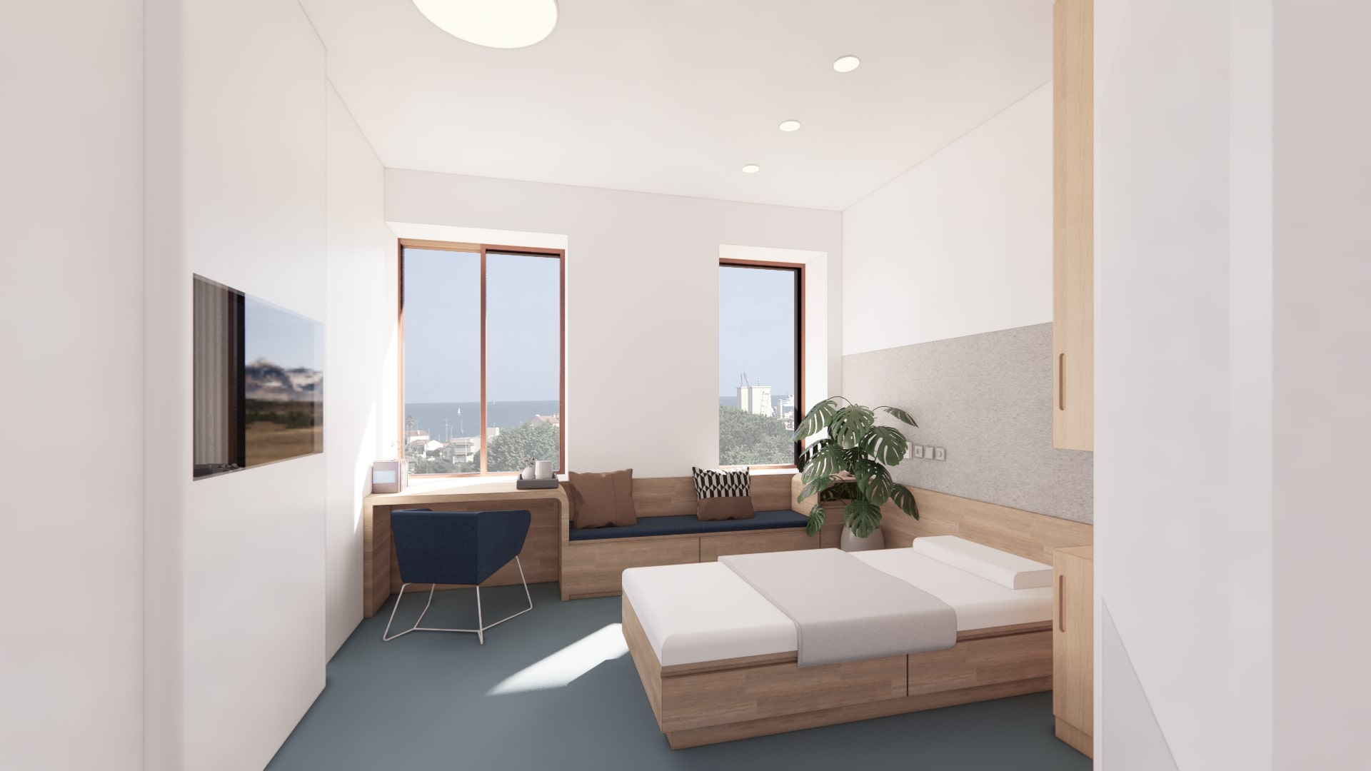 Bright patient room with panoramic view at the Centre Hospitalier in Antibes, revealing A26's approach to patient comfort and hospital ergonomics through modern interior design